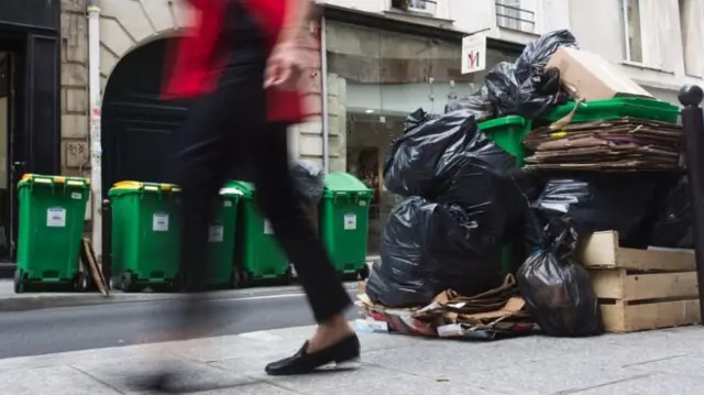 Bin bags in street in Paris