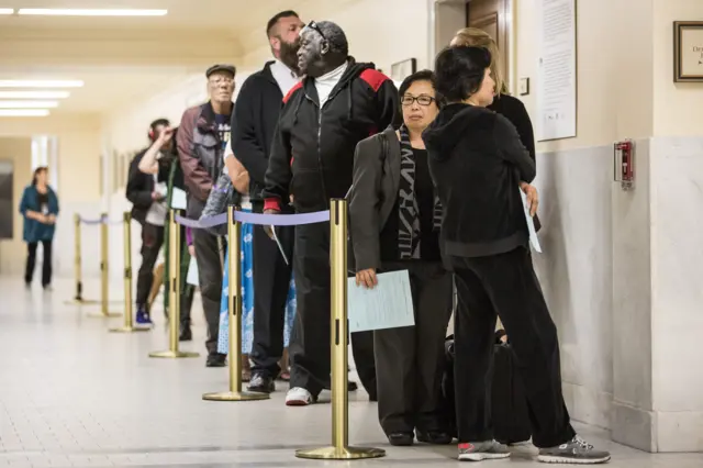 People wait in line to vote in the California primary on June 7, 2016 at City Hall in San Francisco, California.