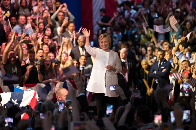 Democratic presidential candidate Hillary Clinton arrives onstage during a primary night rally at the Duggal Greenhouse in the Brooklyn Navy Yard, June 7, 2016 in the Brooklyn borough of New York City.