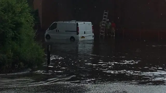 Van in floodwater