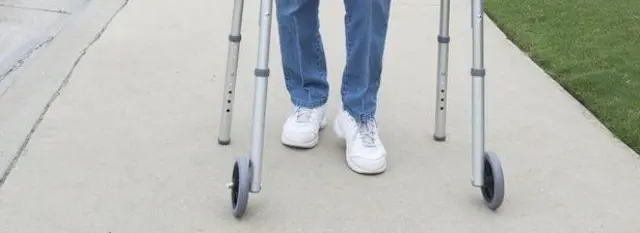 Disabled person with walking aid