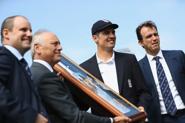 Alastair Cook is presented with a silver bat