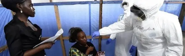 Health workers treating patients in Liberia