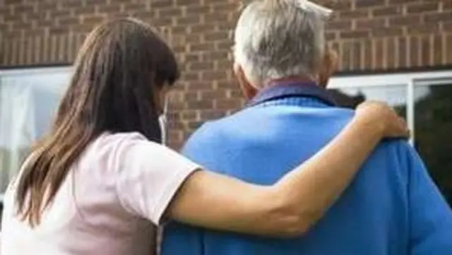 Carer with elderly man