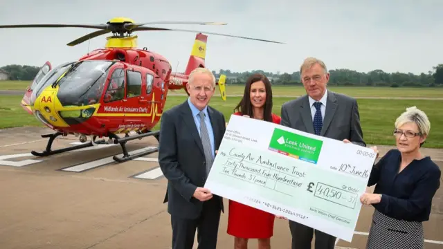 The cheque being donated to the Midland Air Ambulance Charity