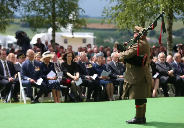 A piper plays at the Ulster Memorial Tower in Thiepval, France, during a service to mark the 100th anniversary of the start of the Battle of the Somme