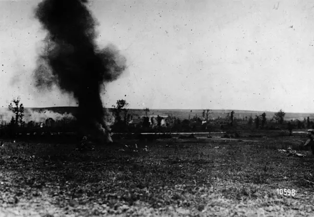 Shell burst and soldiers advancing