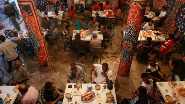 People breaking their fast in Libya