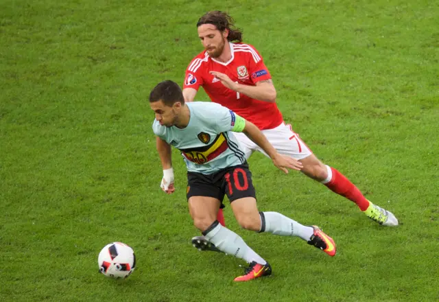 Joe Allen challenges Eden Hazard