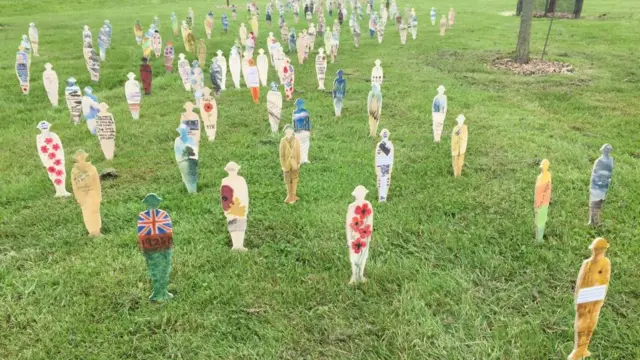 Painted soldier statues at National Memorial Arboretum