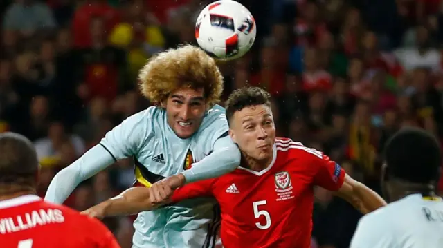 Marouane Fellaini beats James Chester in the air