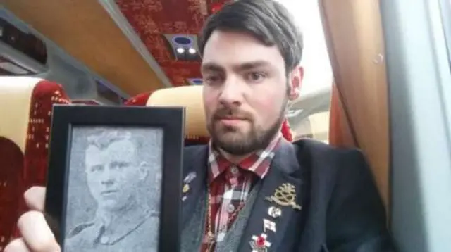 Callan Chevin with picture of his great-grandfather