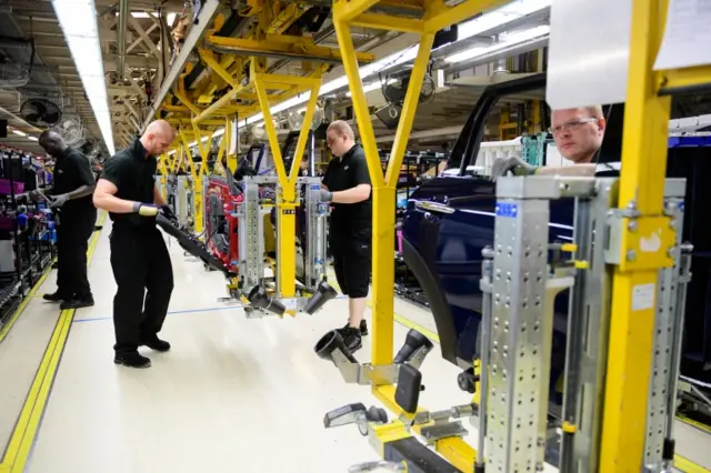 Workers on Mini assembly line in factory near Oxford