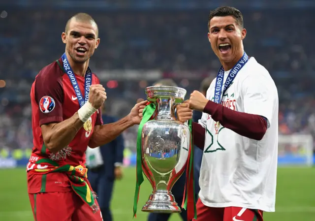 Pepe and Cristiano Ronaldo celebrate with the trophy