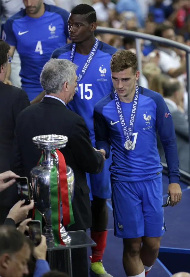 Antoine Griezmann collects his medal