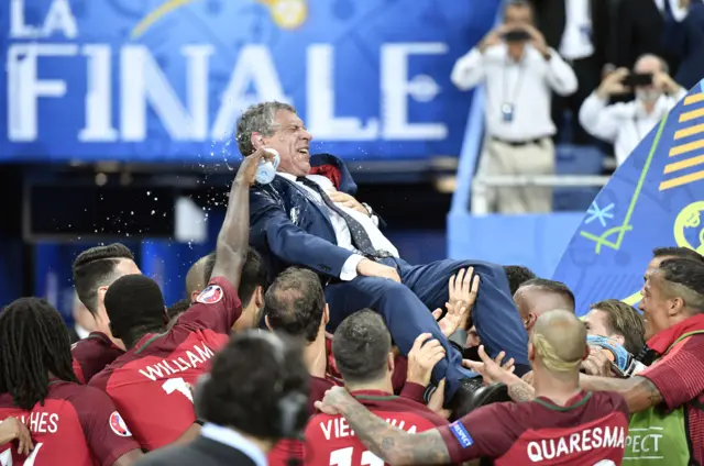 Fernando Santos is lifted by his players