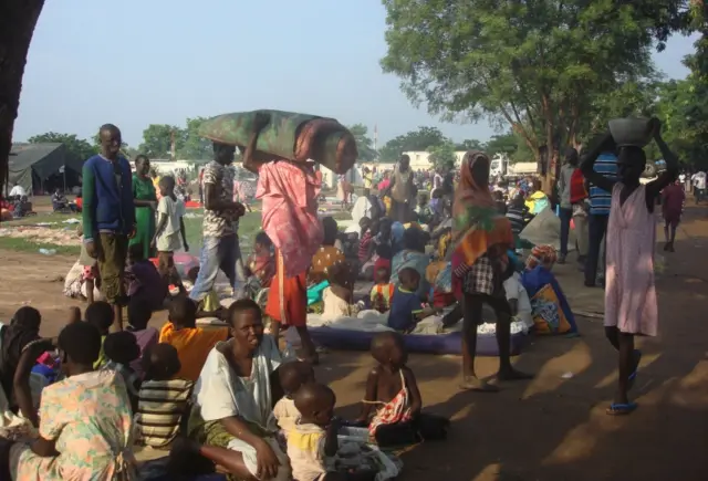 At least 3000 displaced women, men and children gather to seek shelter in Juba, South Sudan at the UN compound in Tomping area, Monday, July 11, 2016