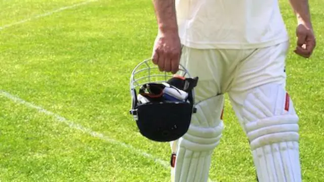 Batsman walking from pitch