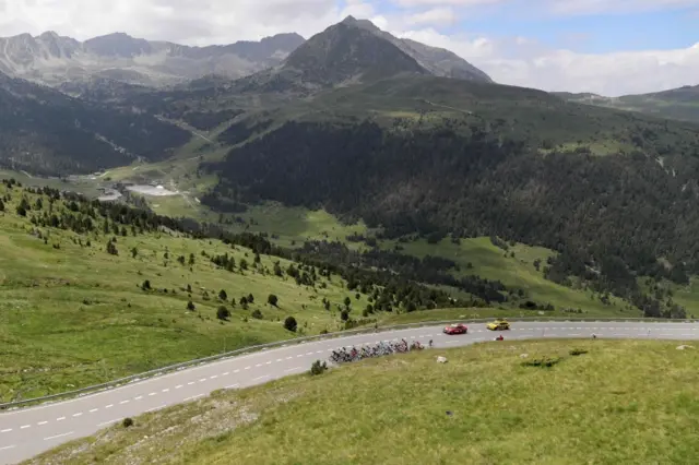 The peloton lead the chase out of Andorra