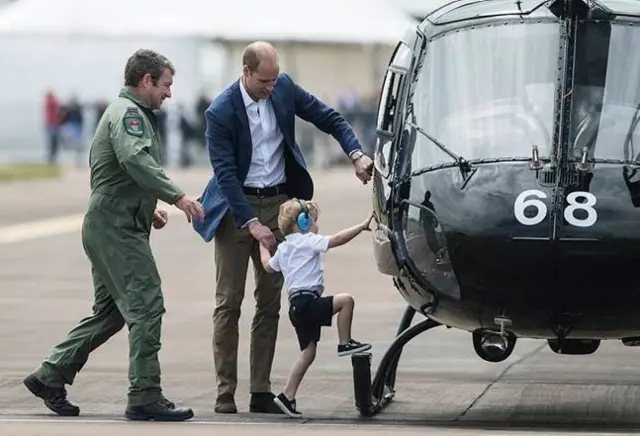 Prince Harry climbing aboard an RAF Shawbury helicopter