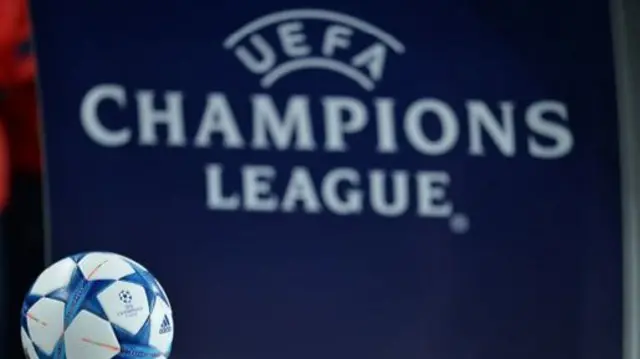 Champions league ball and sign