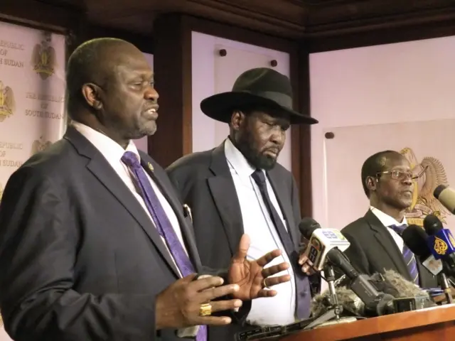 In this photo dated Friday July 8 2016, South Sudan Riek Machar, left. Salva Kiir, South Sudan President, and James Wani Igga, Vice president during a press conference at Presidential palace in Juba, South Sudan, after fighting started erupted when a group of unidentified soldiers tried to enter the palace.