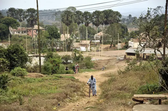 A man pushes his bicycle along a path in the town of Mbanza-Ngungu, in the western part of the Democratic Republic of Congo, on September 10, 2015.