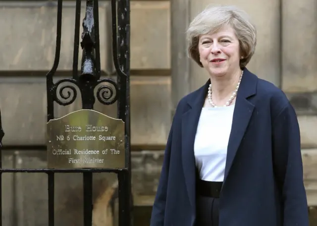 Theresa May outside the first minister's house in Edinburgh