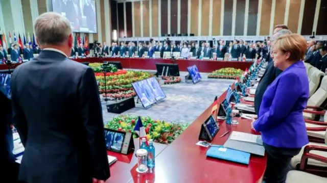 Leaders at the Asia-Europe meeting in Mongolia stand for a minute's silence for the victims of the Nice attack