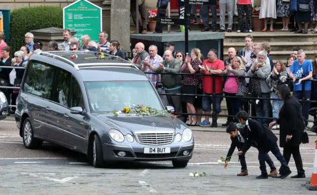 People leave flowers for Jo Cox