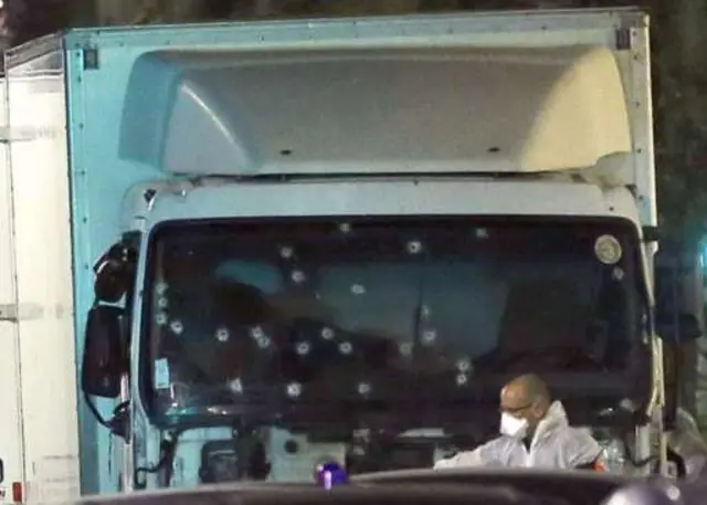 Image of lorry with shot windscreen