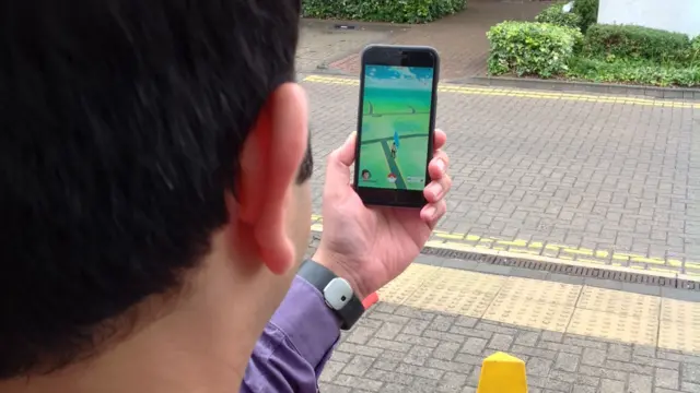 Person playing Pokemon GO