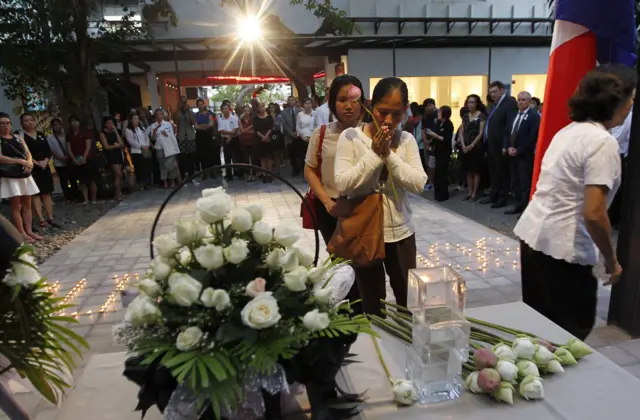 Cambodian citizens pray during a ceremony at French Institute in Phnom Penh, Cambodia