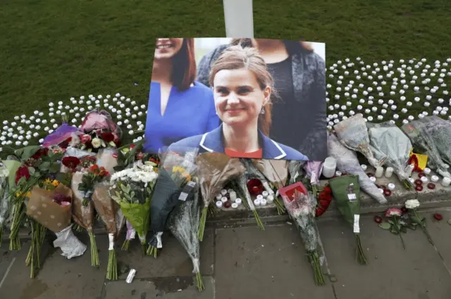 Bouquets of flowers at a memorial for the late MP Jo Cox