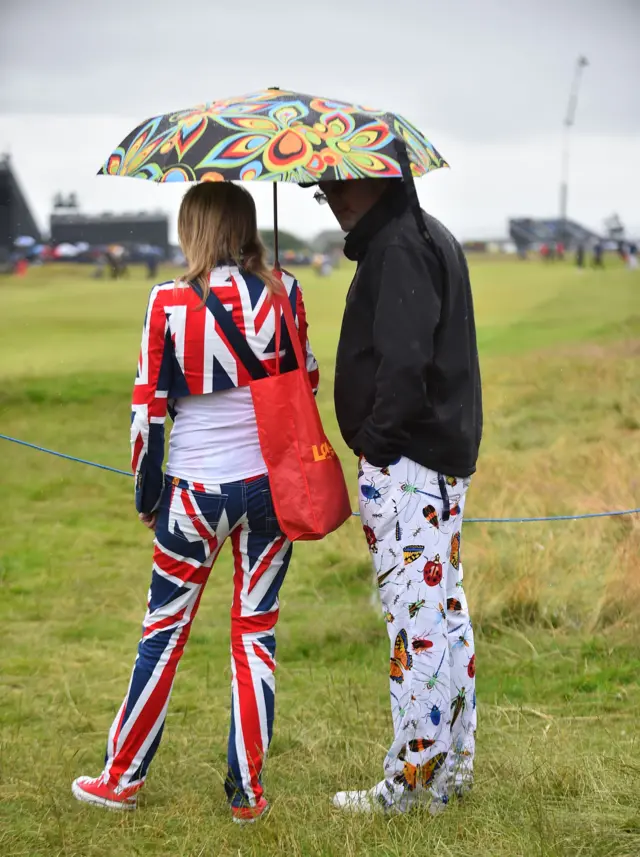 A couple in union jack outfits