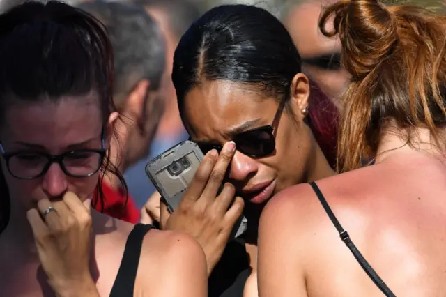 People mourning the dead in Nice