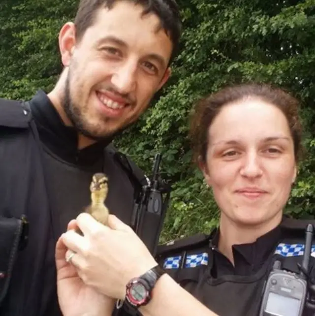 PC Christopher Baldwin and PC Charlotte Sullivan with the duckling