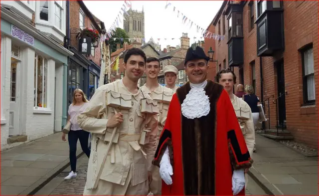 Melvyn Prior and people taking part in parade