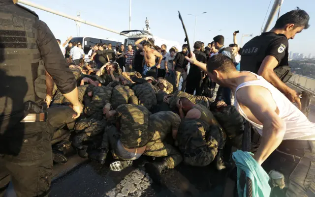 Surrendered Turkish soldiers who were involved in the coup are beaten by civilians on Bosphorus bridge in Istanbul, Turkey, July 16, 2016