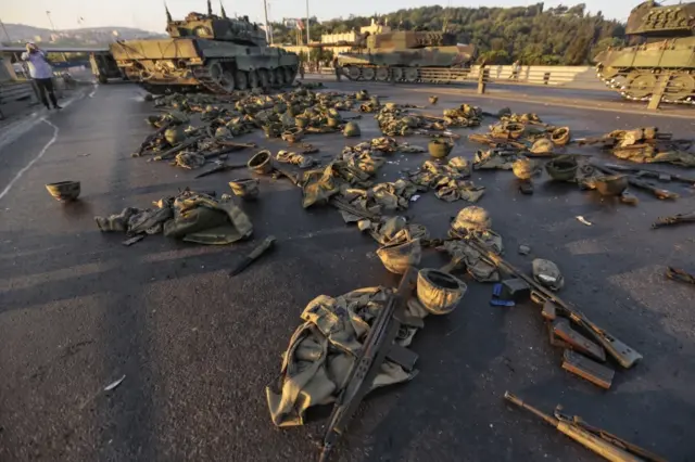 Clothes and weapons belonging to soldiers involved in the coup attempt lie on the ground abandoned on the Bosphorus bridge