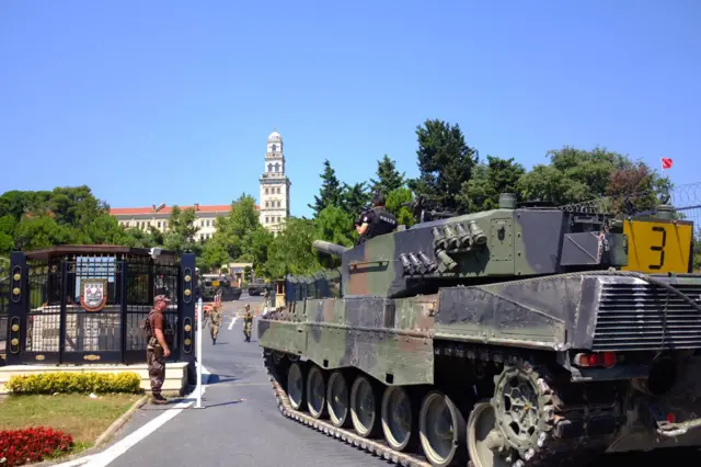 Police officers drive some of the tanks that were used by soldiers participating in the attempted coup, back to the Selimiye Army Base in Istanbul, Saturday, July 16, 2016