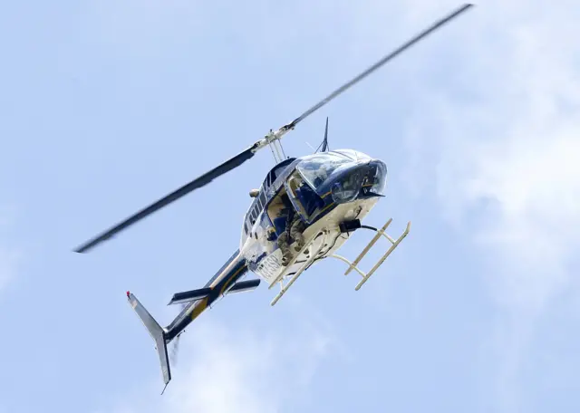 Police helicopter flying above the crime scene