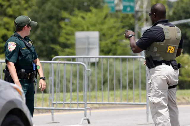 Police officers block a road