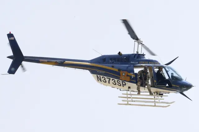 A law enforcement helicopter is seen near the scene where police officers were shot in Baton Rouge, Louisiana