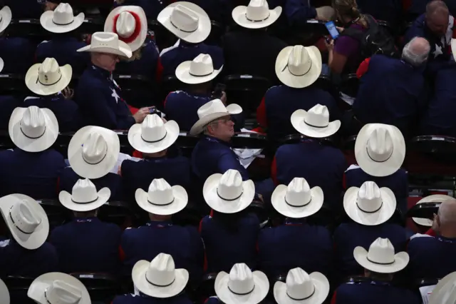 : Delegates from Texas wear cowboy hats during the first day of the Republican National Convention.