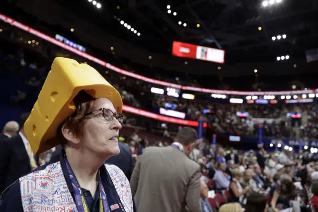 Barbara Finger from Oconto, Wis., wears a cheesehead hat during first day of the Republican National Convention