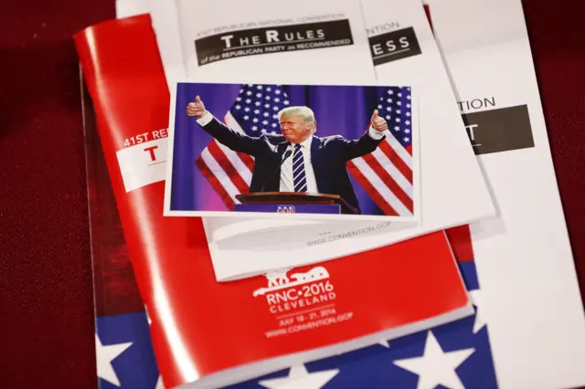 Pamphlets on the chairs of the state delegates on the floor on the first day of the Republican National Convention.