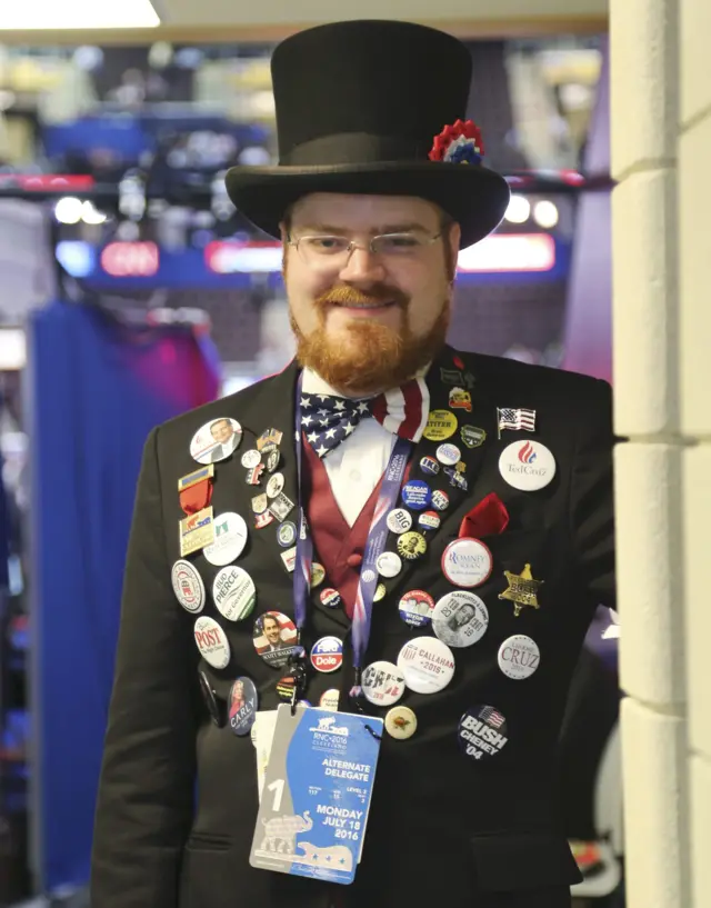 Oregon alternate RNC delegate Nathan Dahlin poses with all of the political buttons that he is wearing at the Republican National Convention.