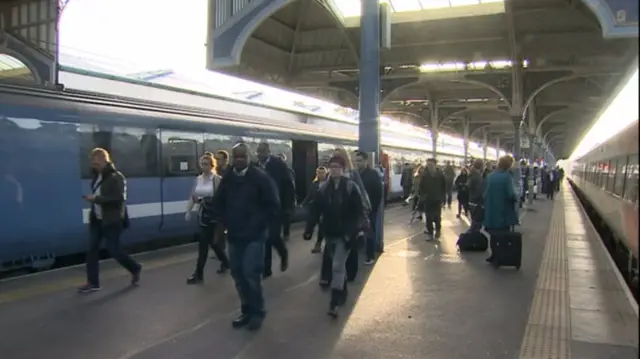 Rail passengers on the platforms at London Liverpool Street