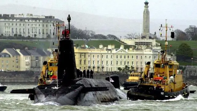 The Royal Navy nuclear submarine HMS Vanguard arriving at Devonport naval base in Plymouth for refit